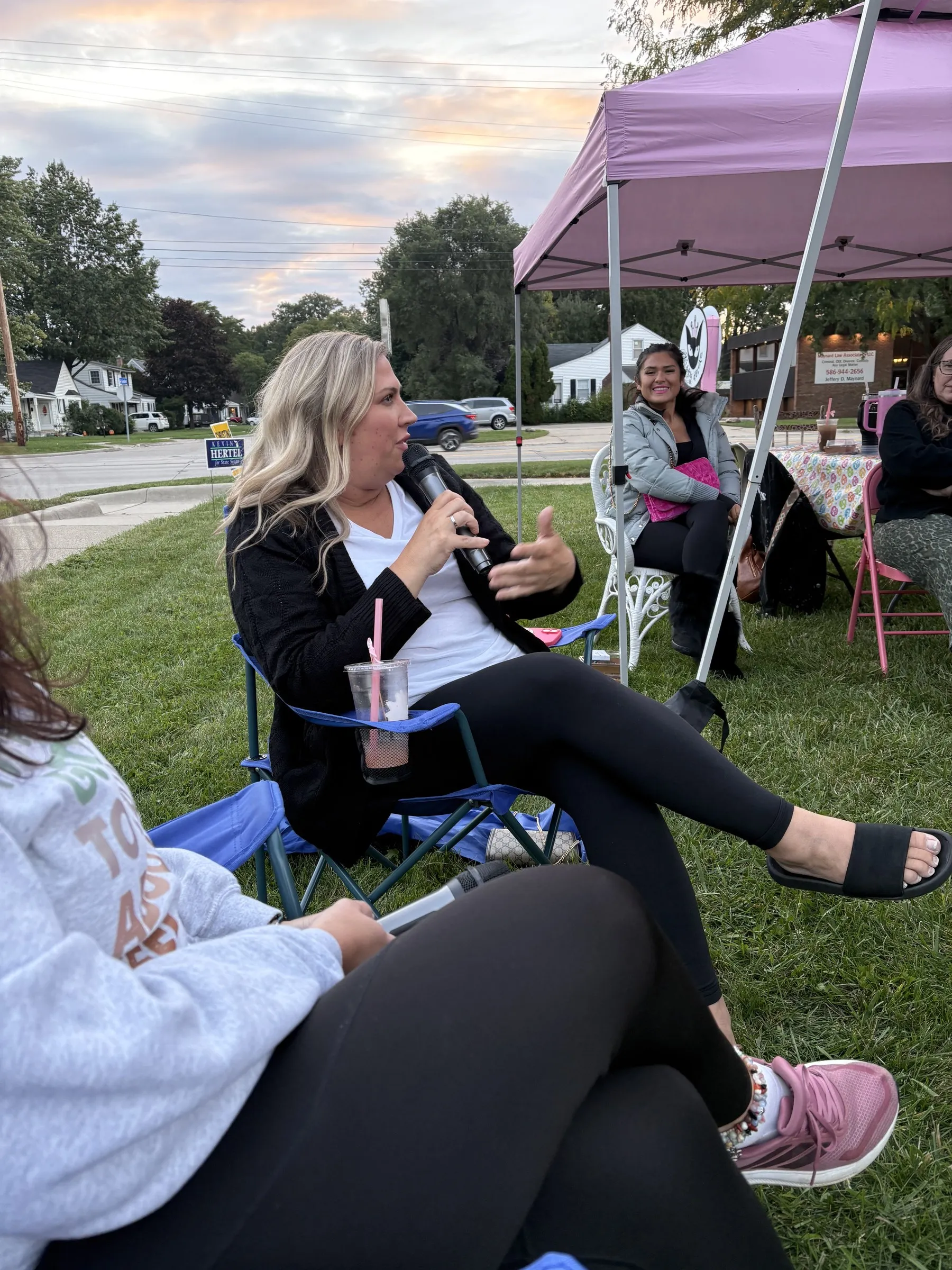 A member speaking at an outdoor chamber meetup on a lawn