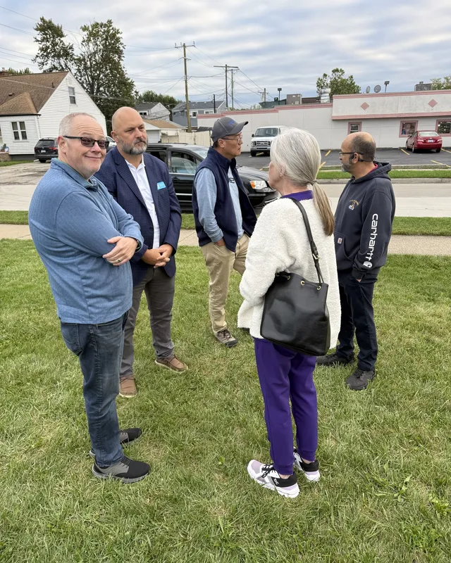 Community members talking together at an outdoor chamber meetup