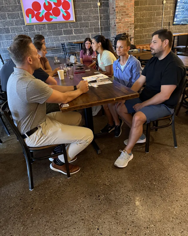 Members talking around a table at a chamber meetup