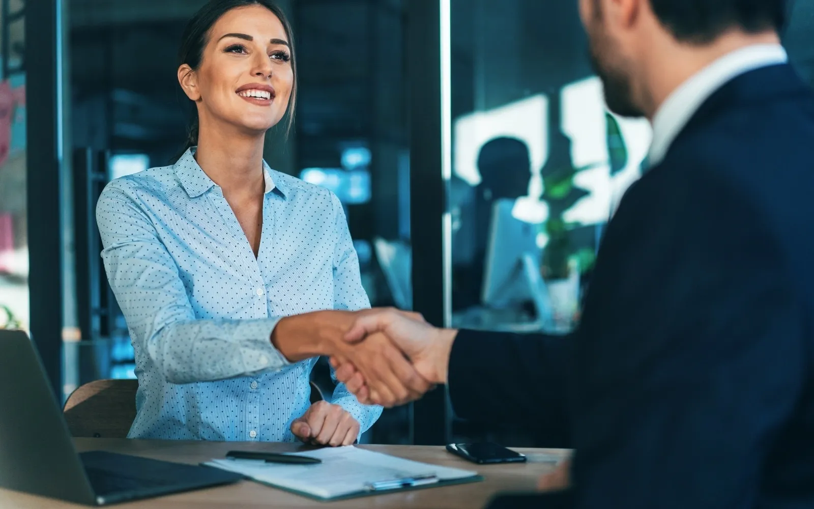 Two business owners shaking hands